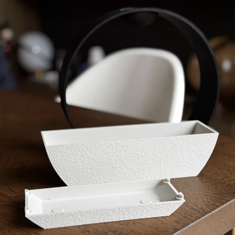 3D-printed stone-textured self-watering flower pot